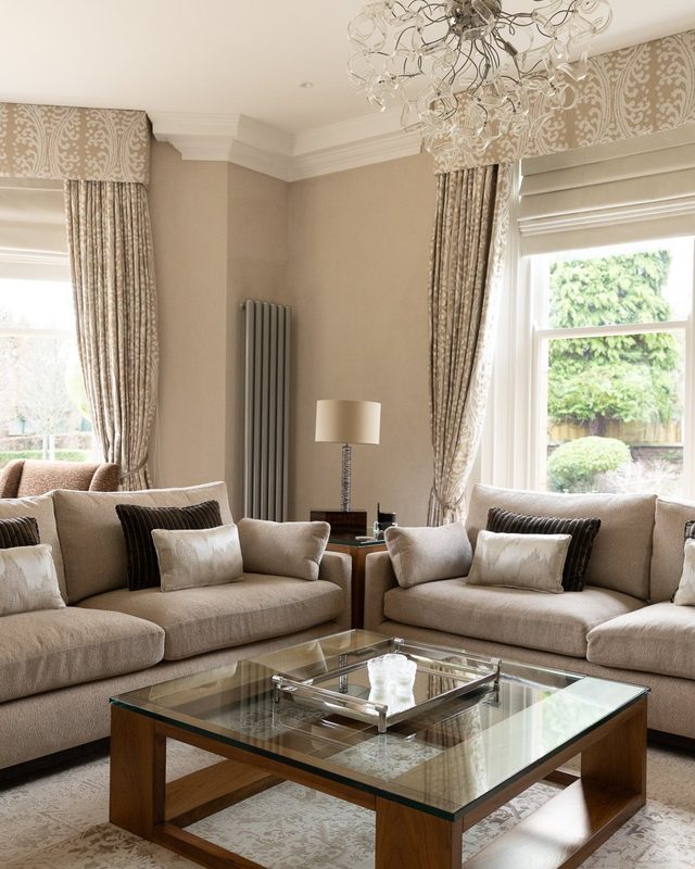 Springfield sitting room with pelmeted curtains, a chandelier and a pair of sofas