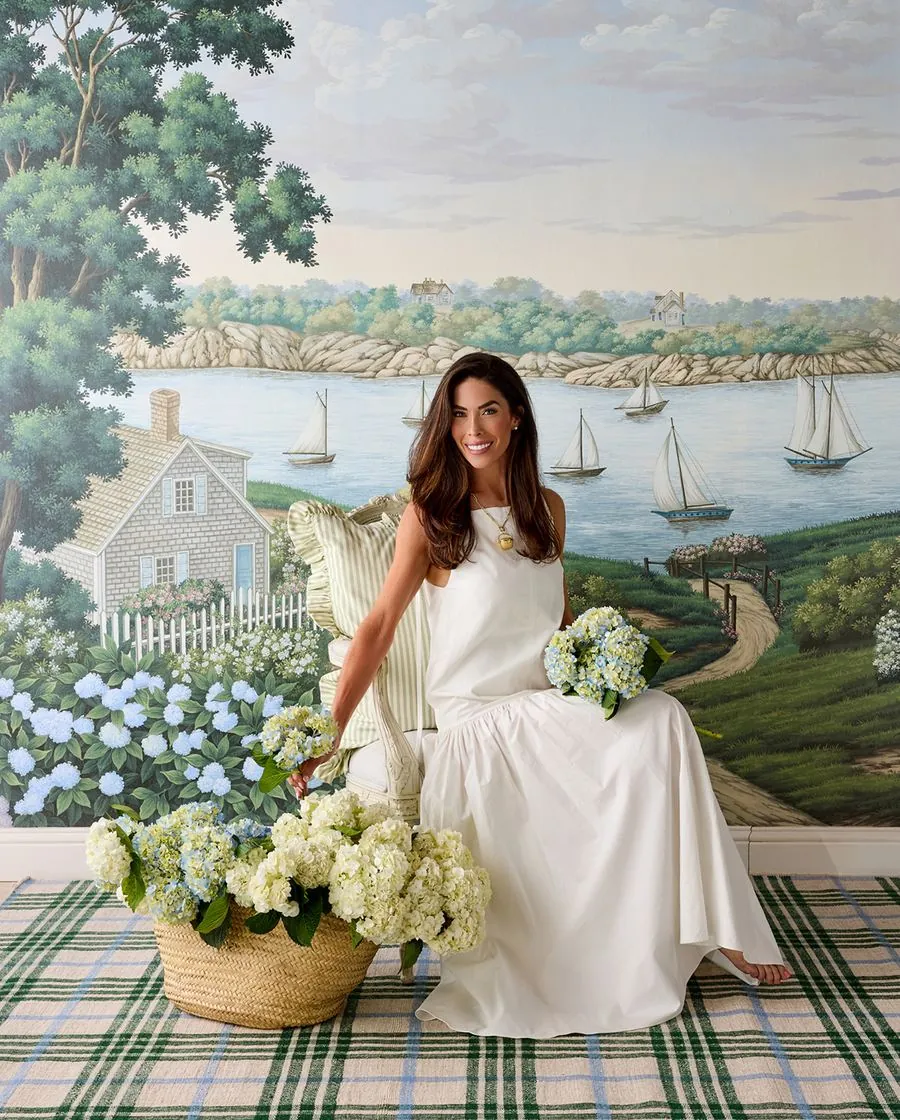 Paul Montgomery paints a Nantucket harbour into a scenic mural for the Caitlin Wilson collection, image via Business of Home