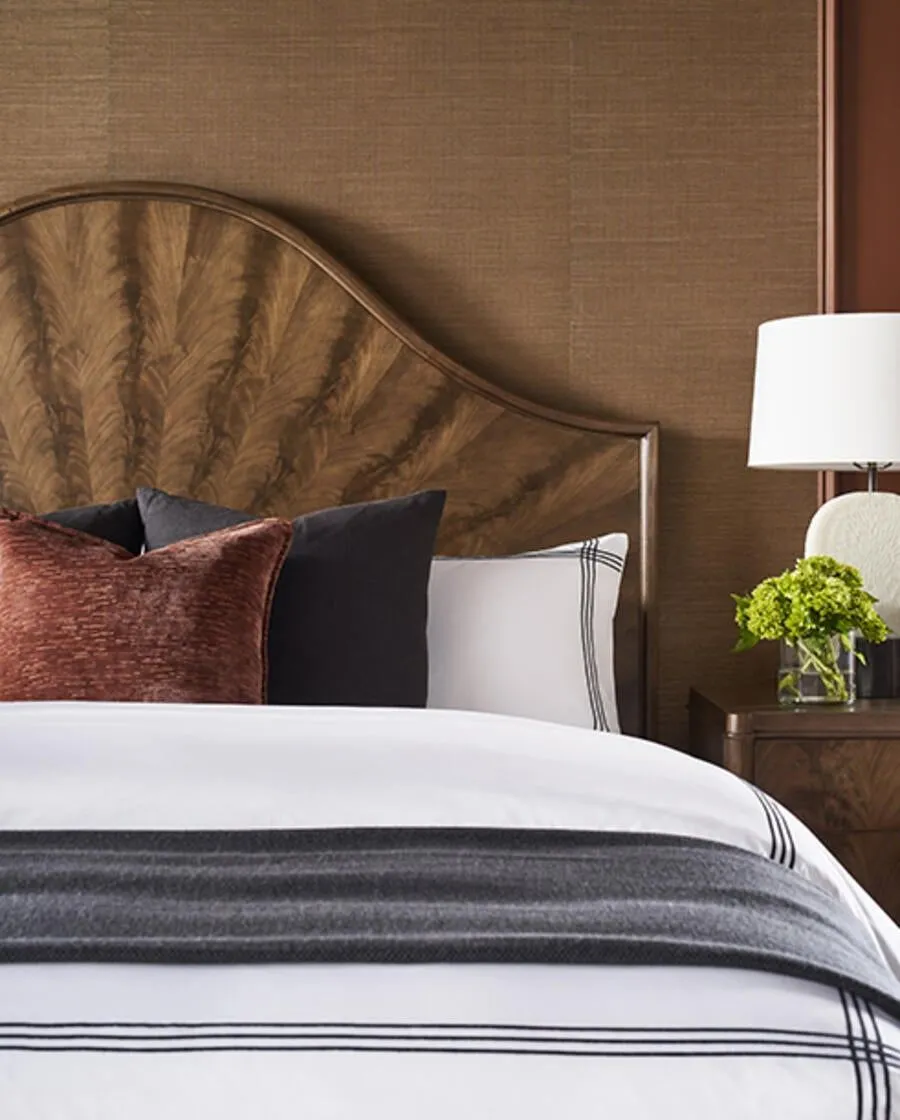 Vanguard's Rendition matches bleached crotch mahogany with lacquered brass, image via Business of Home